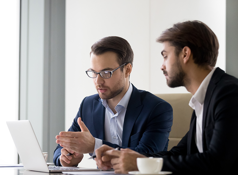 ObligoCC consultants reviewing contract documents